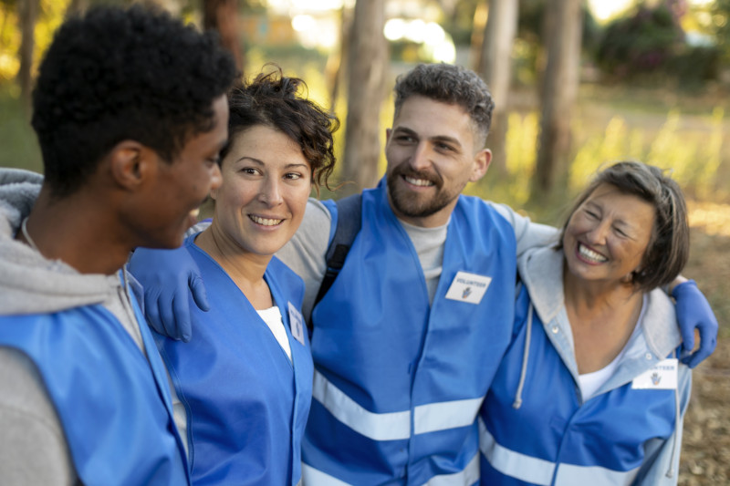 a group of people looking at each other smiling